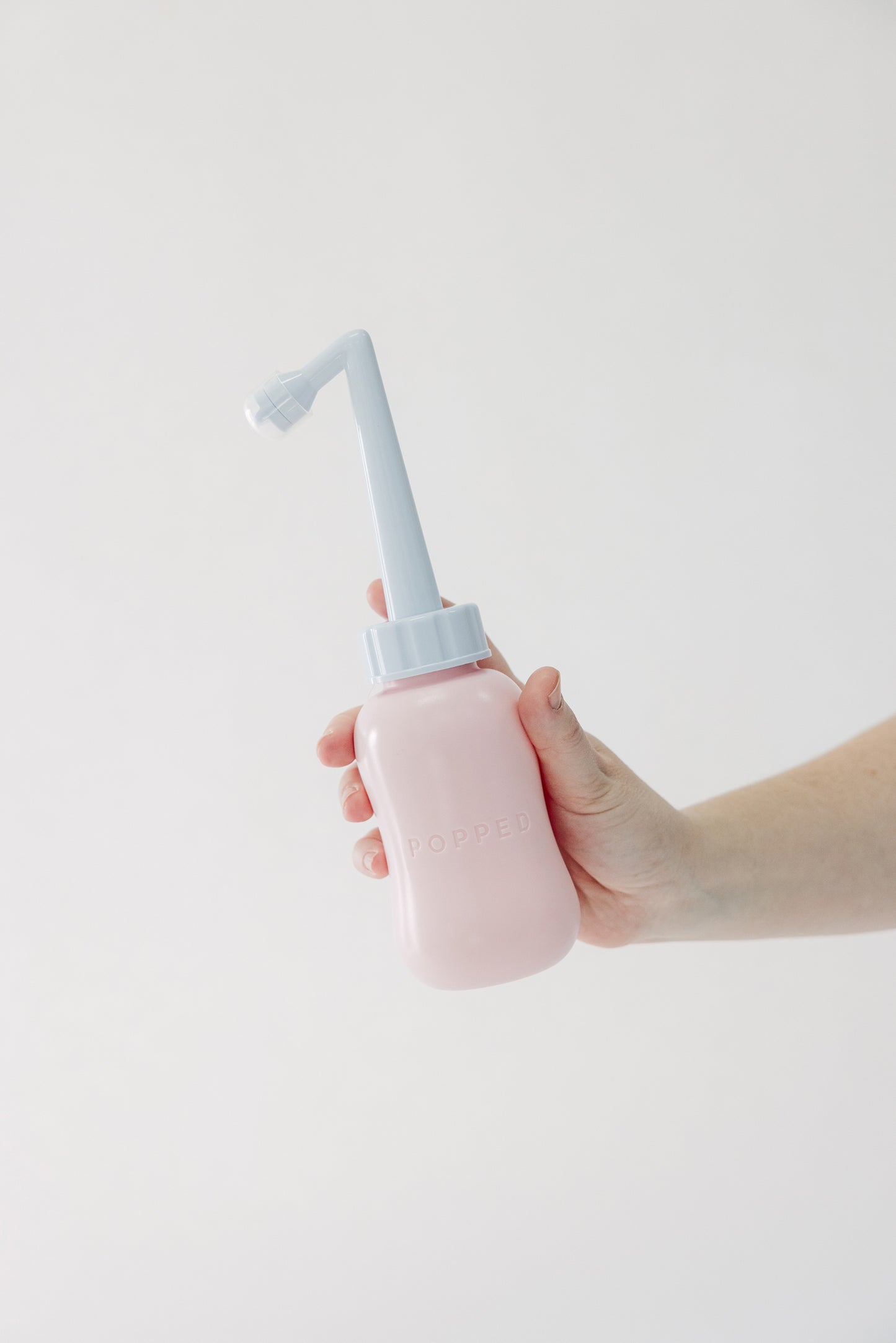 The Tush Premium Survival Bundle featuring clinical-grade support for the fourth trimester. Popped bidet-style peri bottle.