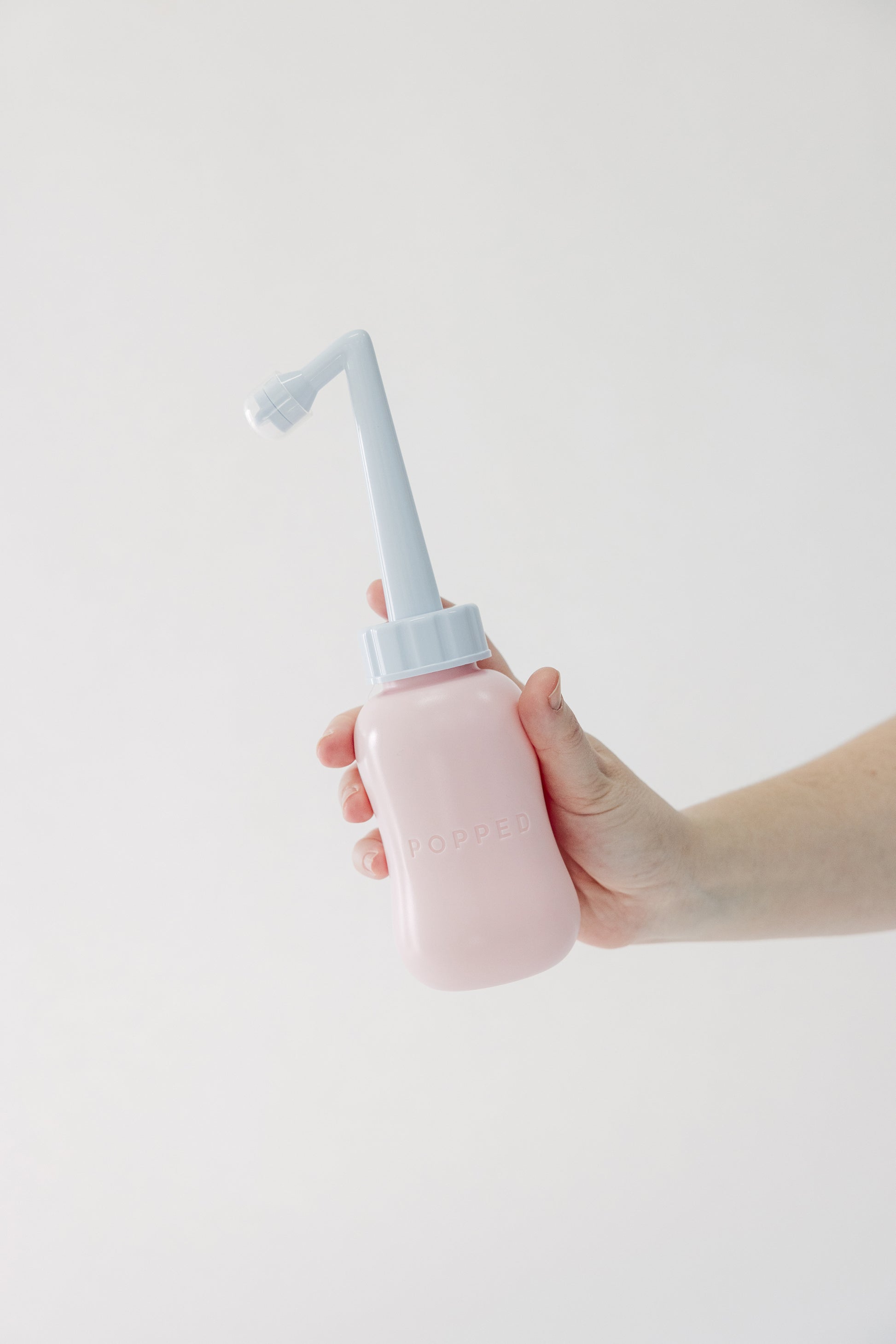 The Tush Premium Survival Bundle featuring clinical-grade support for the fourth trimester. Popped bidet-style peri bottle.