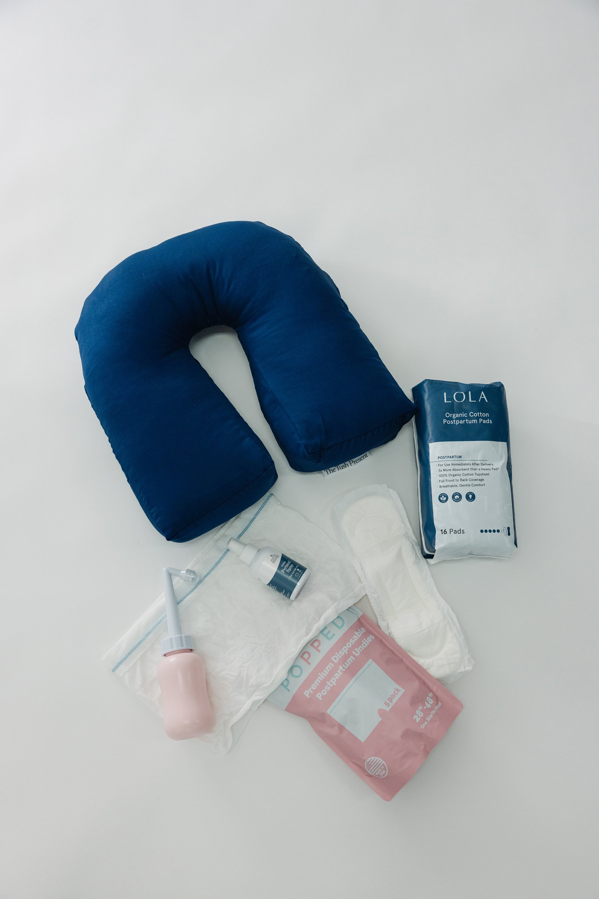 The Tush Premium Survival Bundle featuring clinical-grade support for the fourth trimester.